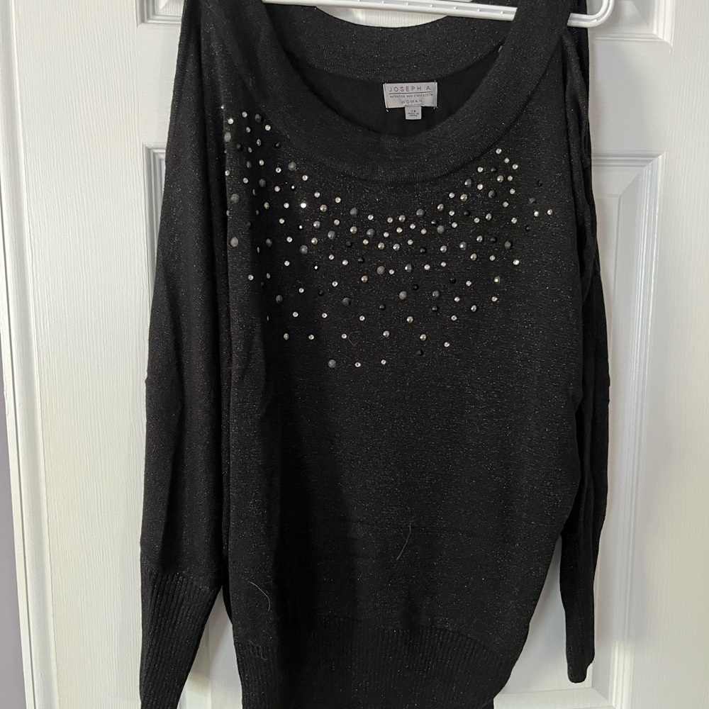 Women’s plus size, cold shoulder sweater.